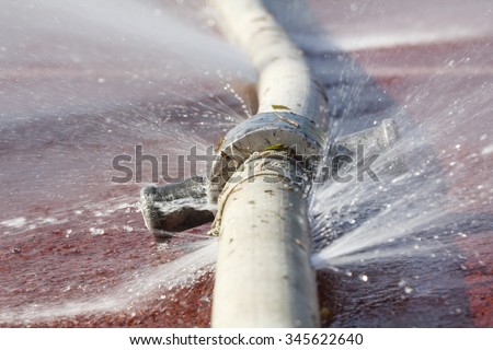 water leaking from hole in a hose