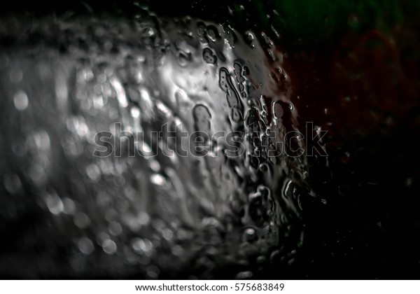 Water leaking over a glass\
surface 