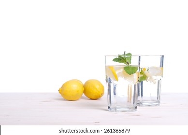 water with lemon and mint in a glass on  table side view of isolation - Powered by Shutterstock