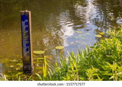 Water level depth meter, gauge or staff. Extreme low water level in river. Global warming. Shortage, scarcity or lack of water or rain due to hot temperatures. Climate change crisis.Co2, part of serie