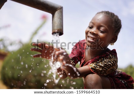 Water is Life for African Children, Little Gorgeous Black Girl Drinking from Tap