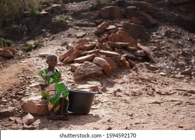 Water is life, Black Young African Girl walks hours to get to Well