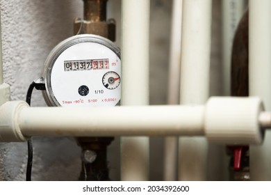 Water Meter Among The Modern Plastic Water Pipes. Water Consumption In The Apartment