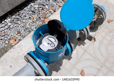 Water Meter And Metal Pipes Blue Color For Measurement Of Water Flow. Water Environmental Conservation And Water Resource Management Concept.