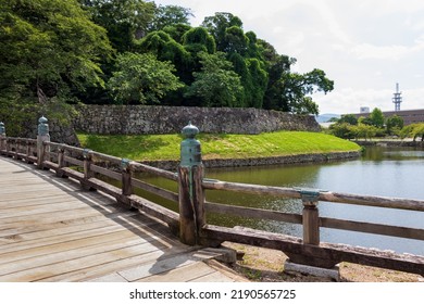 Water Moat And Wooden Bridge Of Hikone Castle