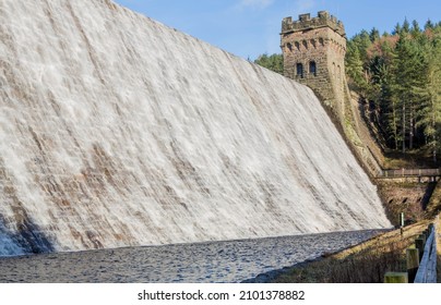 Water overflowing Derwent Dam in Derbyshire UK into Ladybower reservoir - Shutterstock ID 2101378882