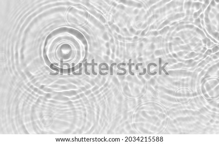 Water panoramic banner background. White aqua texture, surface of ripples, rings, transparen and sunlight. Spa concept background. Flat lay, top view, copy space