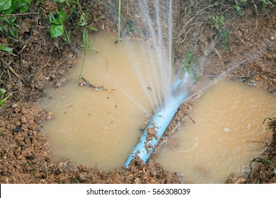 Water pipe break,  leaking from hole in a hose,selective focus 