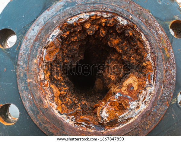 Water pipe clogged.Very Old Corroded and\
Blocked Steel Household Pipes.old  pipe built up layer of\
corrosion.Use as illustration for\
presentation.\
