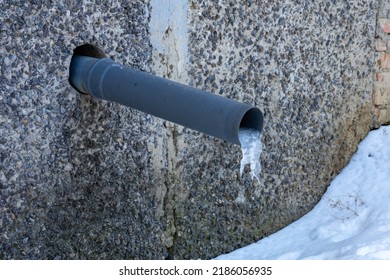 A Water Pipe In A House With A Frozen Piece Of Ice. Rainwater Harvesting