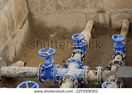 Water pipe replacement. Reconstruction of the underground sewer system in city street. Elimination of the accident on the underground pipeline. Installation of new pipes and valves. Industrial concept