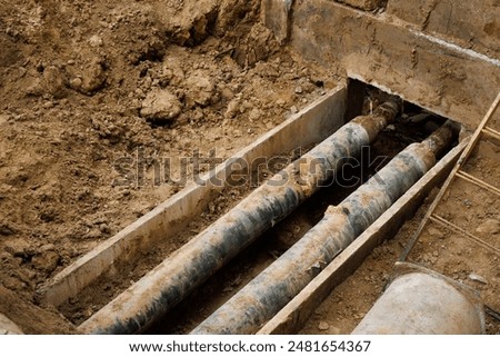 Water pipe replacement. Reconstruction of the underground sewer system in city street. Elimination of the accident on the underground pipeline. Installation of new pipes and valves. Industrial concept