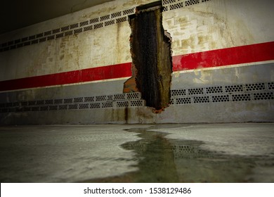 Water Pooling From Water Damaged Wall  In An Underground Basement Wall