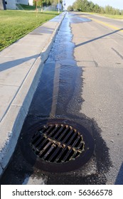 Water Pouring Into Street Storm Drain