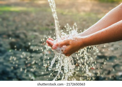 Water pouring on hand in morning ligth background - Powered by Shutterstock