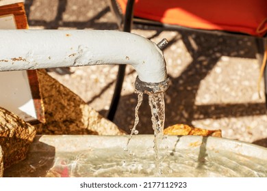 Water Pours From A Water Column In The City Of Nitra In Slovakia. Spring Clean Water.