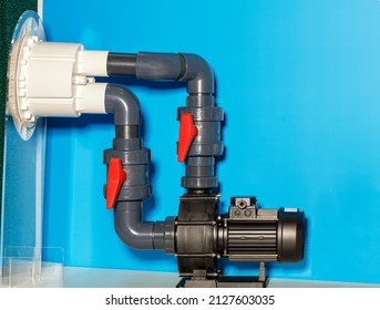 The Water Pump For Water Circulation In Small And Medium Sized Domestic Pools Is Connected With Plastic Pipes With Valves On The Example Of A Layout. Copy Space.