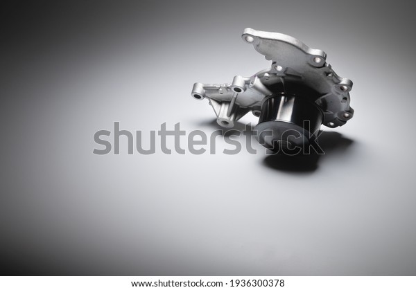 Water pump of the internal combustion\
engine cooling system. Contrasting on a gray\
gradient