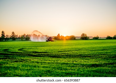 water pump at sunset in a big green field Europe - Shutterstock ID 656393887
