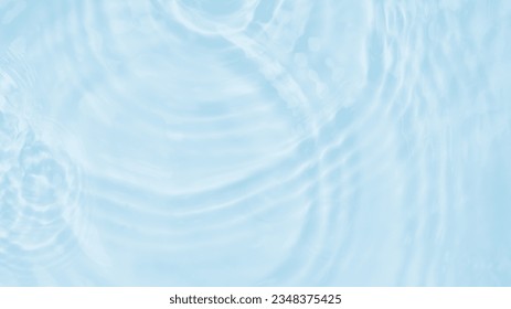 Water Pure Blue with sunlight top view Background, Circle wave pattern water well free space display product, Transparent blue clear water surface texture with ripples, splashes. Abstract summer
