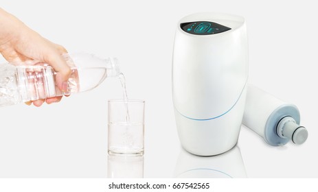 The water purifier, cartridge filter for tap water clearing and treating. Pouring water from plastic bottle into a glass. Technology concept.