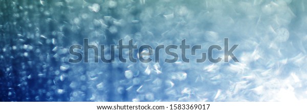 Water\
rain drops  blue Vintage on glass wall  on car  rain drops on clear\
window  or rain droplets on glass Of Raindrops Or Vapor Trough\
Window Glass Water droplets blue and Rain\
droplets