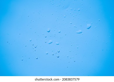 Water Or Rain Drops On Blue Plastic Sheet Background 