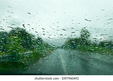 The Water Rain On The Front Window Of The Car.