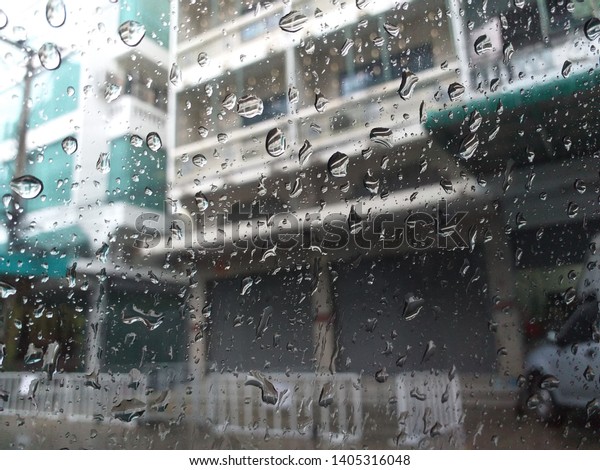 Water rain on the glass\
window car
