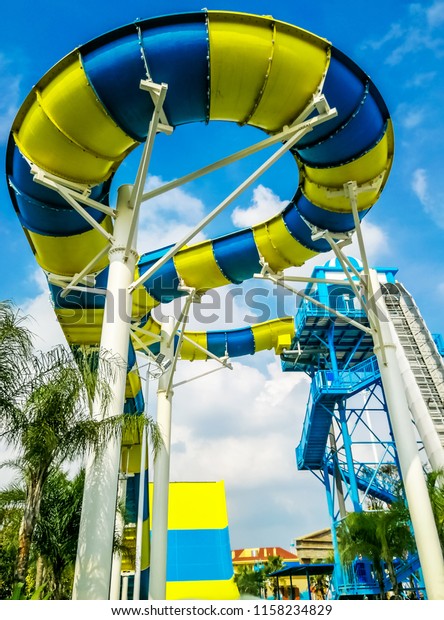 Water recreation facilities under blue sky and\
white clouds