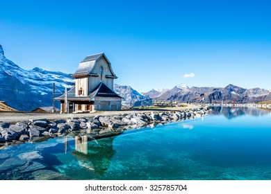 Water reflection in  mountain lake above Grindelwald, Switzerland.