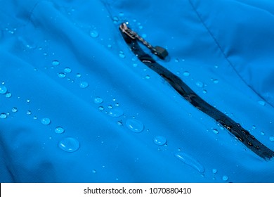 Water repellent coating durable repellency fabric outdoor shell jacket with water drops. Waterproof membrane with droplets.