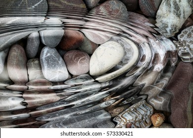 Water ripples over the stone pebbles - digitally altered