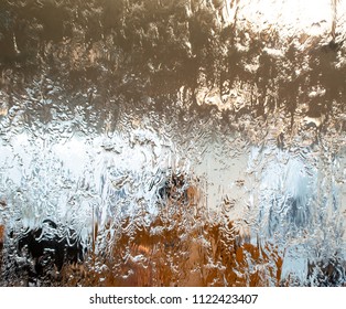 Water Running Down Glass, Ripples, Patterns And Reflections.