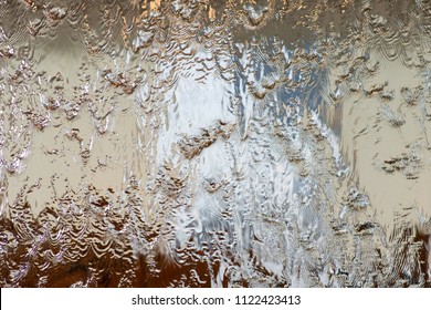 Water Running Down Glass, Ripples, Patterns And Reflections.