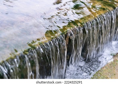 Water Running Down The Stone Step.