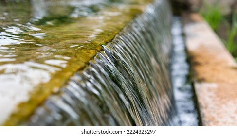 Water Running Down The Stone Step.