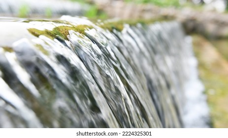 Water Running Down The Stone Step.