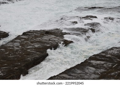 Water Running Off Coastal Rocks