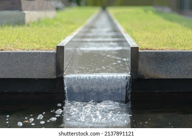 Water Running In Rainspout In The Garden