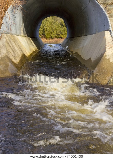 Water Running Through Large Round Culvert Stock Photo (Edit Now) 74001430