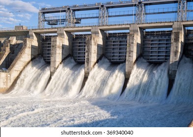 Water Rushing Out Of Open Gates Of A Hydro Electric Power Station