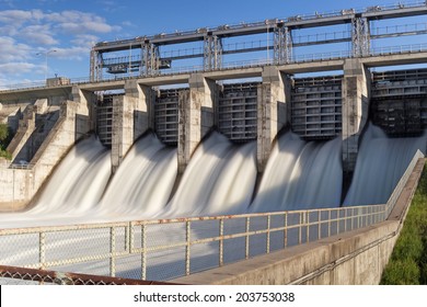 Water Rushing Through Gates At A Dam