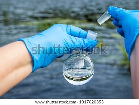 A water sample from the river. Water intake. Water abstraction.  Water diversion.