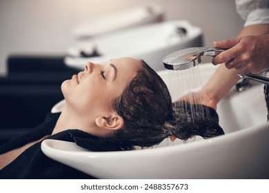 Water, shampoo and hair care for client with hairdresser, salon and scalp treatment with massage. Basin, tap and washing with hands for dye hairstyle, relax and customer person for keratin service - Powered by Shutterstock