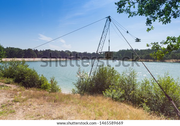 Water ski\
resort with a blue sky in the\
background.
