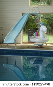 Water Slide, Unicorn Floatie And A Pool