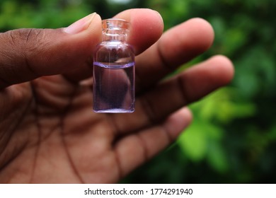 Water small bottle on the hand 