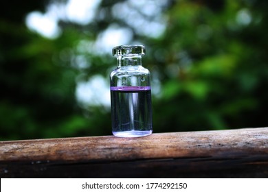 Water small bottle on the wood 