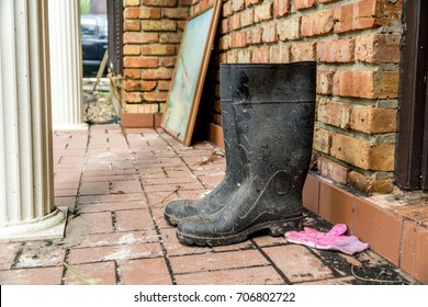 Water Soaked Rain Boots Next To A Flooded Home After Hurricane Harvey 